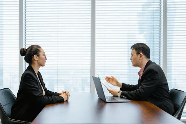 asian female candidate giving interview for job answering the question How Can You Contribute to the Company?